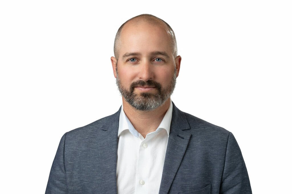 headshot of hunter macleod experience senior living svp of real estate development