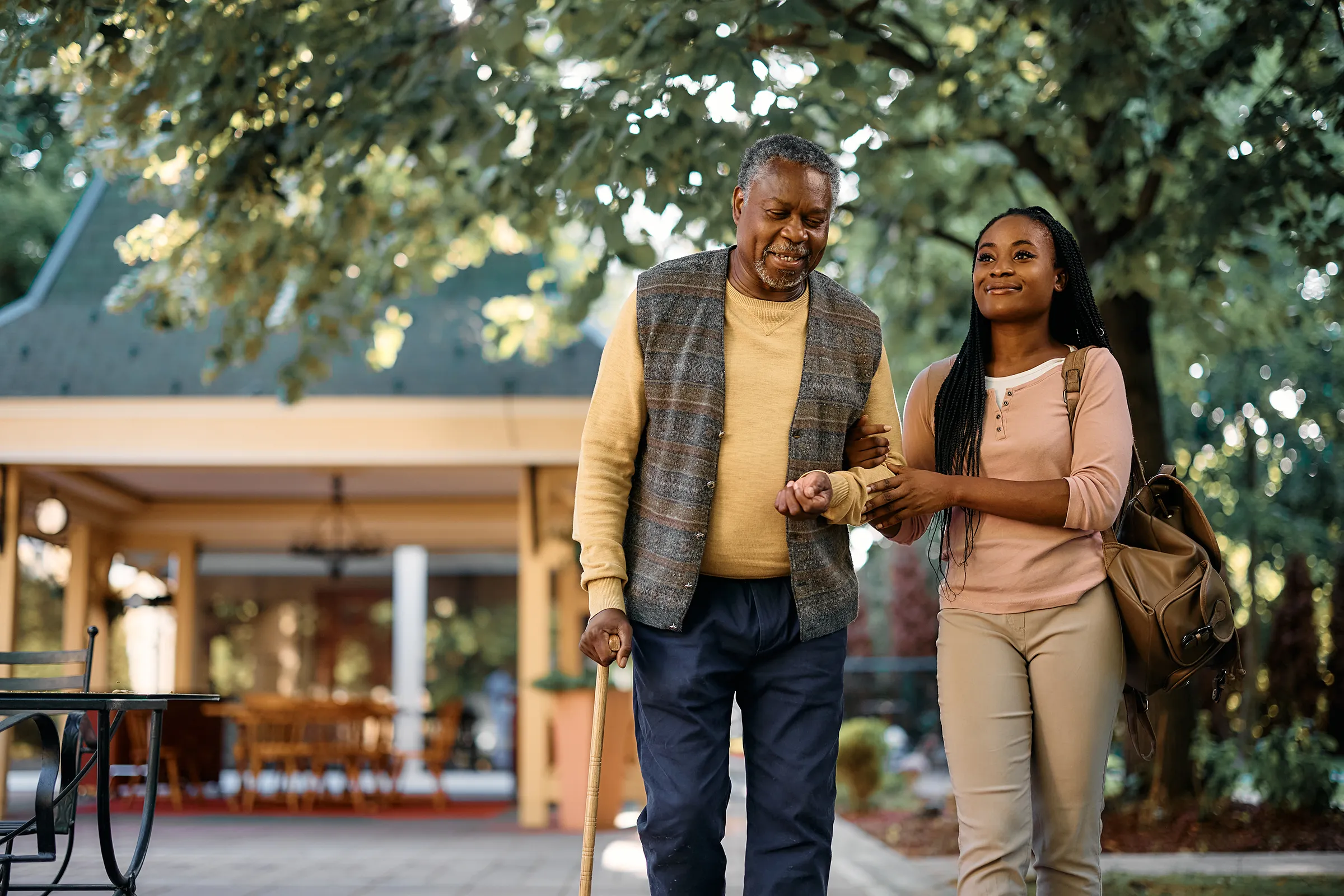 assisted living man and daughter out for a walk
